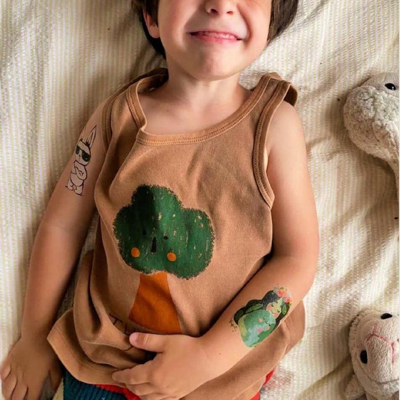 Boy Wearing Mother Earth Temporary Tattoo Transfers. Set of 3 Body Stickers. Earth Day Party Fake Tattoos To Promote Harmony With Nature.