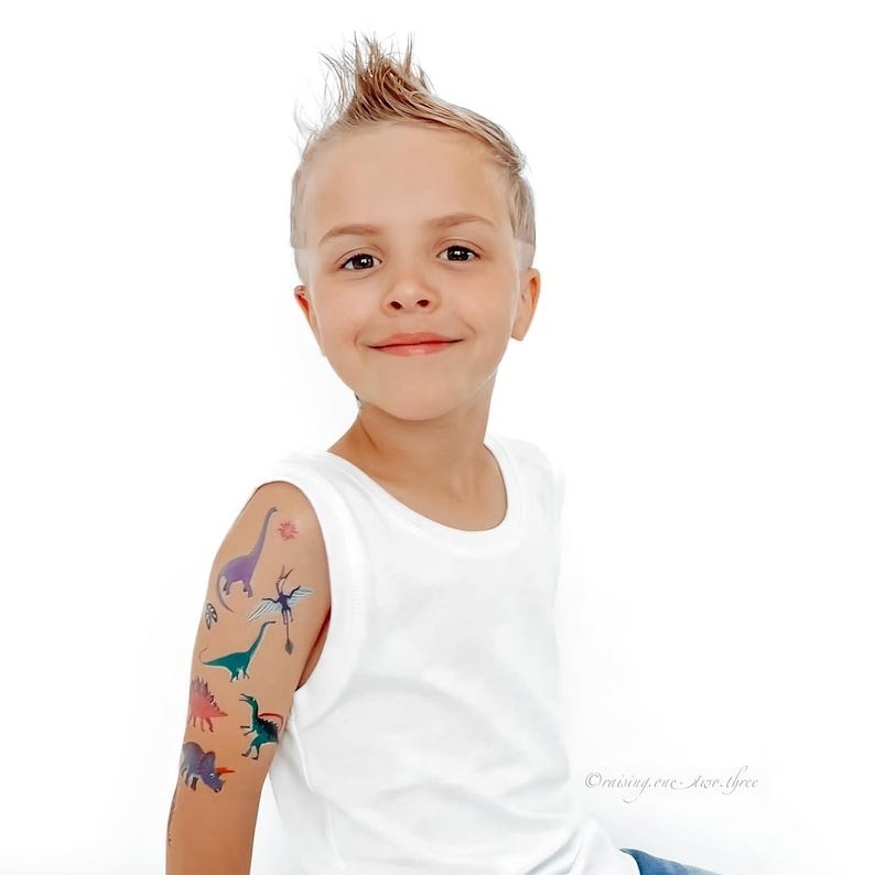 Boy Wearing Dinosaur Party Temporary Tattoos. Dino Birthday Favors. Body Stickers. Gifts For Kids.