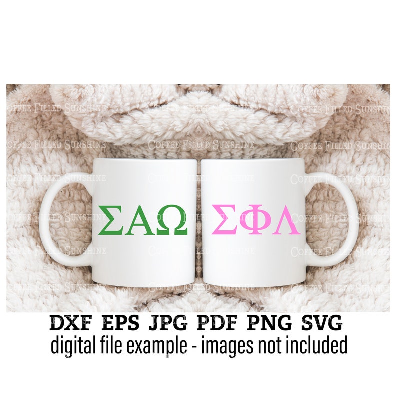 May include: Two white ceramic mugs with handles. The mug on the left has the Greek letters "&Sigma;&Alpha;&Omega;" in green. The mug on the right has the Greek letters "&Sigma;&Phi;&Lambda;" in pink. The mugs are sitting on a white fuzzy surface.