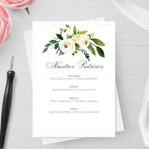 May include: A white card with a floral design in the top left corner. The text "Nuestros Padrinos" is in a black cursive font. The card lists the names of the wedding party members and their roles, including "Velación", "Enlace", "Anillos", and "Salón".