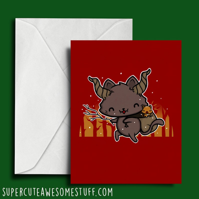 May include: A red greeting card with a black cat with horns and a small brown cat on its back. The cat is standing in front of a gold and orange forest. The card has a white border.