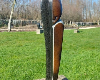 Stone sculpture — a head, handmade in Zimbabwe, with powerful design and beautiful contrasts, by a Tengenenge sculptor, shona art