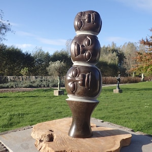 Stone statue, playful sculpture, differen heads or faces piled on top of each other, handcrafted in Africa, shona-art, gift idea, decoration
