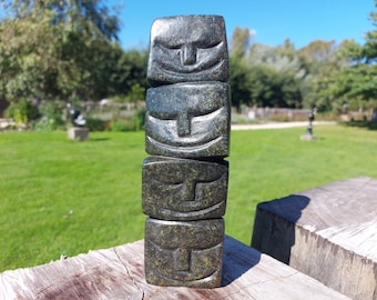 happy faces, balancing faces, stone sculpture made by Gift Anthonyo out of 1 stone, shona art Zimbabwe
