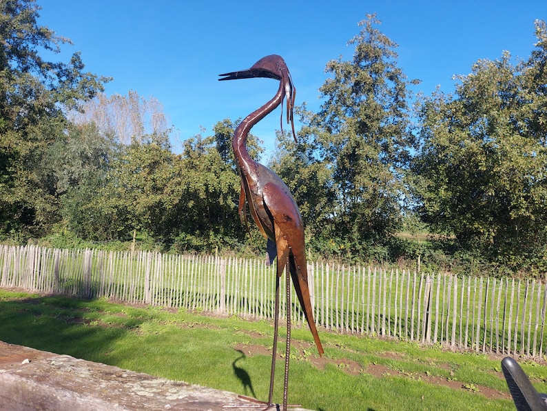 metal heron, metal art, yard art, this heron is made from oil drums, handcrafted in Zimbabwe, it makes a great addition to your garden.  each heron comes with 2 hooks to secure them in the soil. Can also be placed on a terrace, veranda...