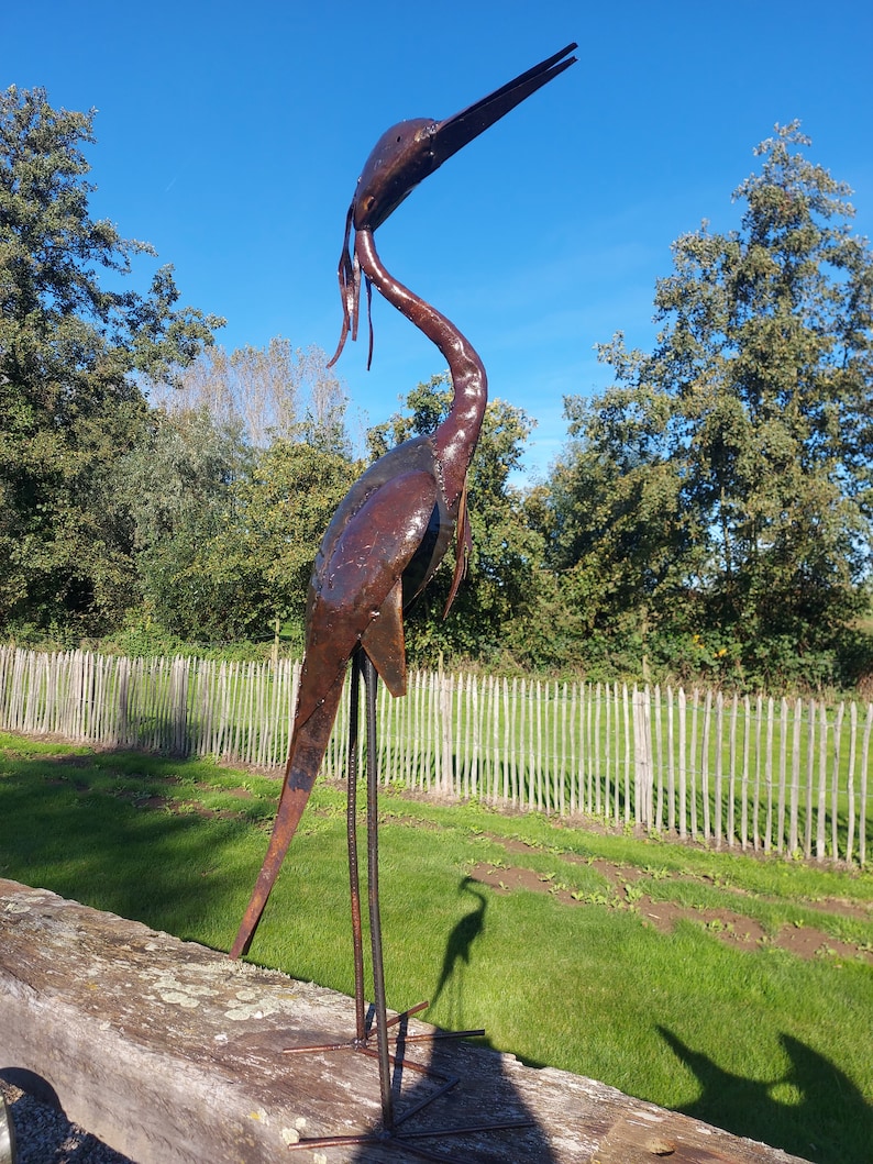 metal heron, metal art, yard art, this heron is made from oil drums, handcrafted in Zimbabwe, it makes a great addition to your garden.  each heron comes with 2 hooks to secure them in the soil. Can also be placed on a terrace, veranda...