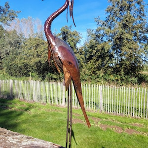 metal heron, metal art, yard art, this heron is made from oil drums, handcrafted in Zimbabwe, it makes a great addition to your garden.  each heron comes with 2 hooks to secure them in the soil. Can also be placed on a terrace, veranda...