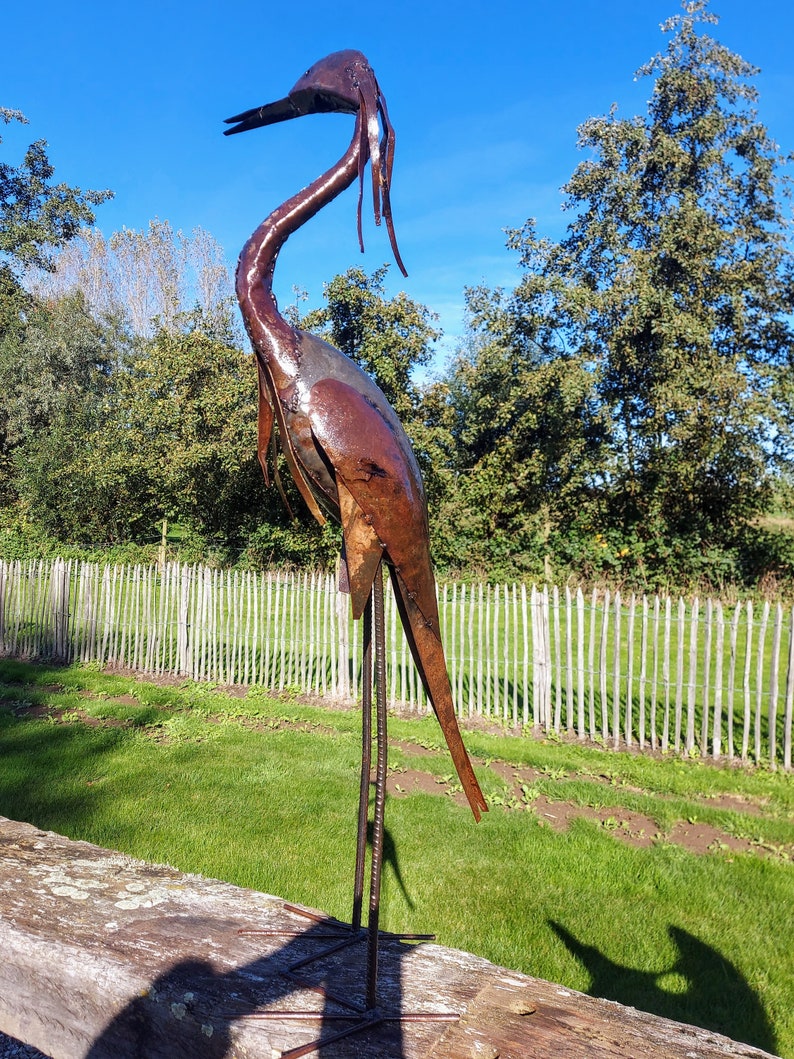 metal heron, metal art, yard art, this heron is made from oil drums, handcrafted in Zimbabwe, it makes a great addition to your garden.  each heron comes with 2 hooks to secure them in the soil. Can also be placed on a terrace, veranda...