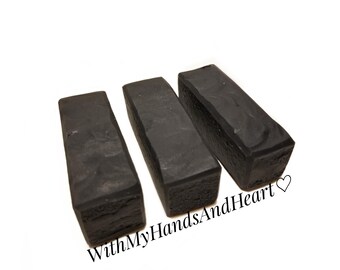 May include: Three dark gray rectangular bars with textured surfaces are arranged on a white background. The bars have a slightly rough, carved appearance. The text "WithMyHandsAndHeart" is visible in the lower right corner.
