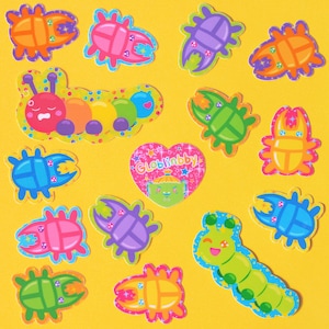 May include: A set of colourful, cartoon-style bug stickers with a heart-shaped sticker that says "Globblinbby". The stickers feature various bugs, including ladybirds, caterpillars, and beetles.