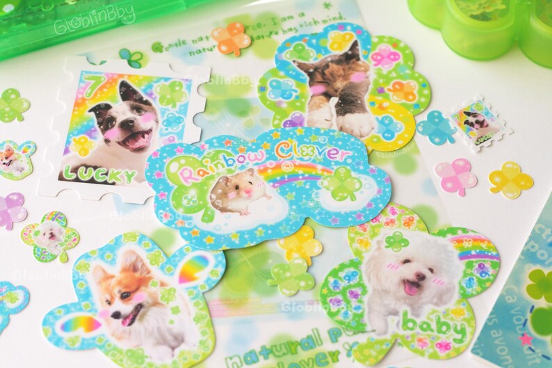 A flat lay of all the clover stickers and some mini clover animal and rainbow clover stickers.
