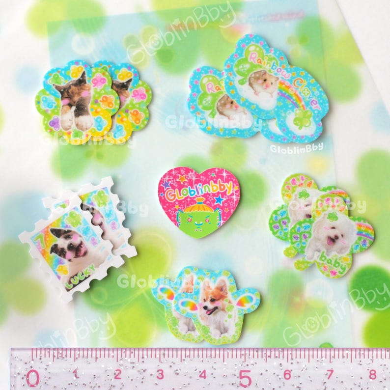 Mini clover animal sticker flakes on a clover memo. The stickers are between 1.5 to 2.6 cm wide.