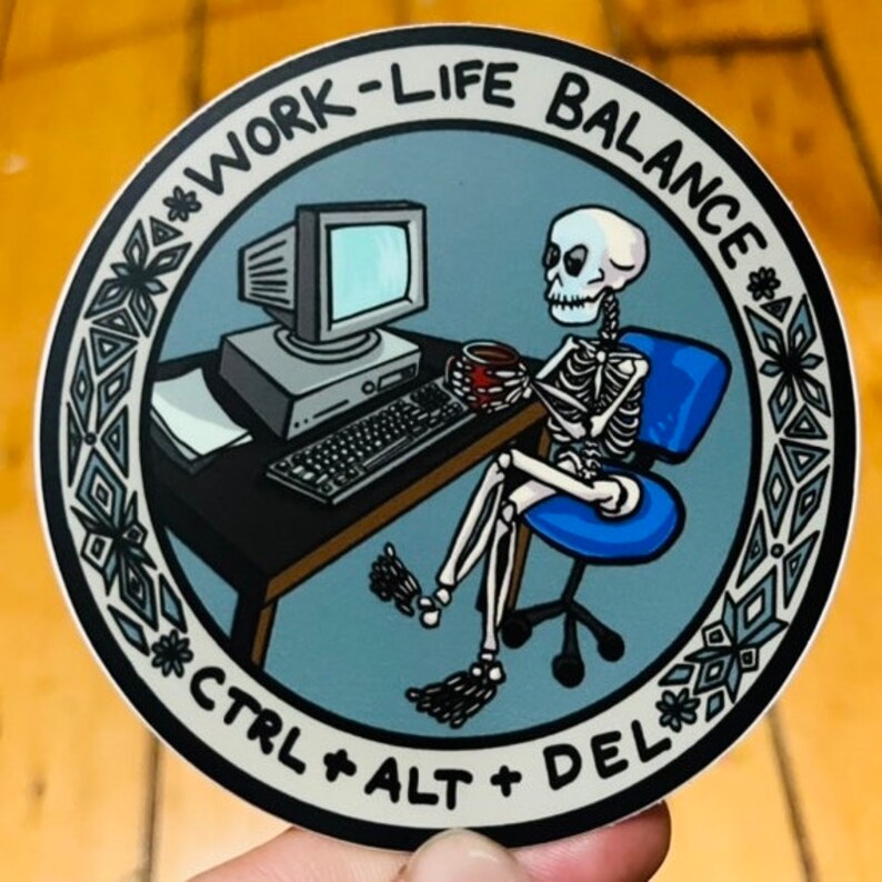 May include: A round sticker with a blue background and a white border. The sticker features a skeleton sitting at a computer desk with a cup of coffee. The text on the sticker reads "Work-Life Balance" and "Ctrl + Alt + Del".