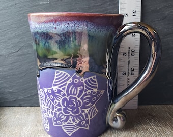 Carved flower with purple and silver mug