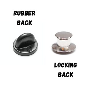 May include: Two different types of pin backs. The first is a black rubber back, labeled "RUBBER BACK". The second is a silver locking back, labeled "LOCKING BACK".