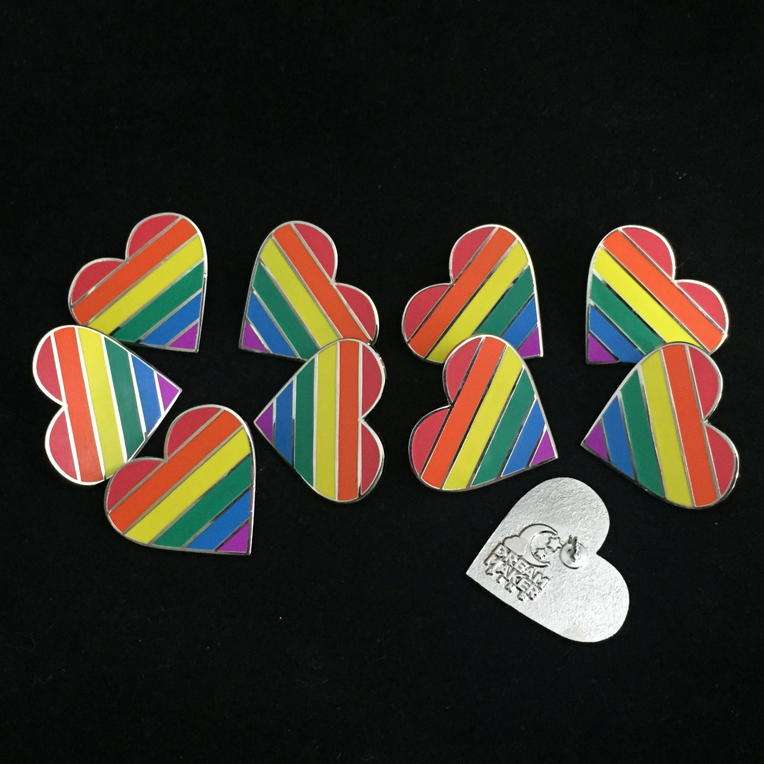 rainbow colored pin and gay pride flag and heart rainbow colored pin and gay pride flag and heart