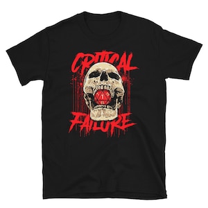 May include: Black t-shirt with a red graphic of a skull biting a red 20-sided die with the number 1 facing up. The text "CRITICAL FAILURE" is written in red above and below the skull.