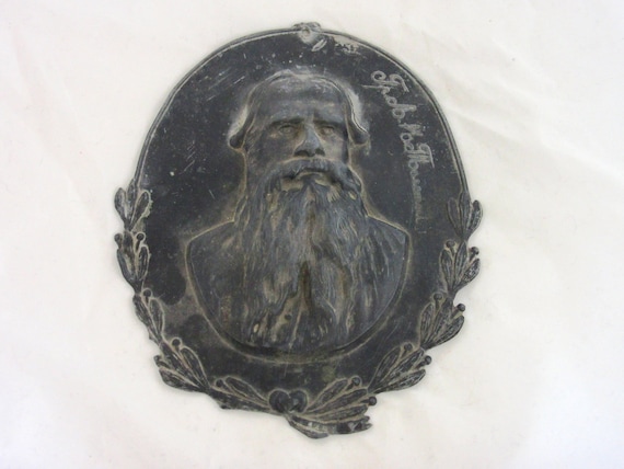 Antique pewter bullet of Leo Tolstoy (Lev Tolstoy) signed by owner.Russian antique pewter plaques of Lev Tolstoy