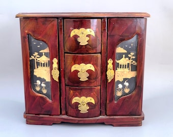 Vintage Chinese Jewelry cabinet decorated with metal leaves and wooden art