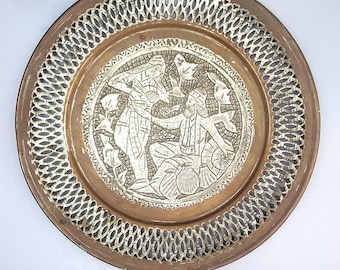 Antique Persian copper plate, plated with tin and decorated with traditional Persian country trade scene. 30 cm diameter