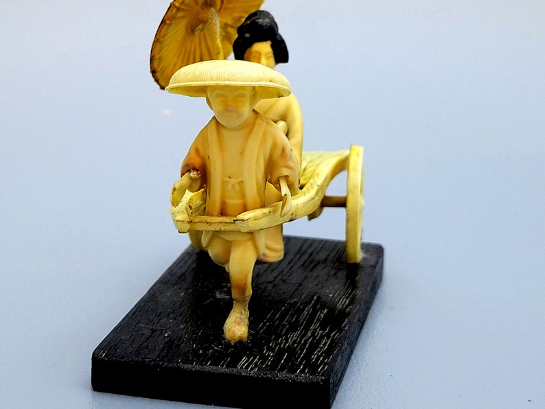 Vintage Japanese Celluloid Miniature Figurine of a Rickshaw Man Driving