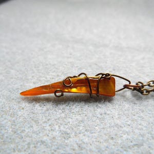 Tooth Shaped Shell Necklace: Wire Wrapped Pendant on Bronze Chain