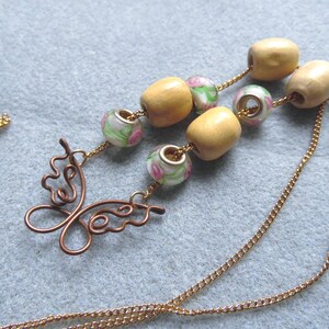 Copper Butterfly Necklace, Long Chain Jewelry with Glass and Wood Beads, Spring Vibes Statement Necklace, Wavy Wire Butterfly Pendant