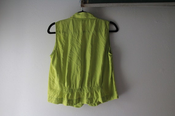 Green silk sleeveless blouse