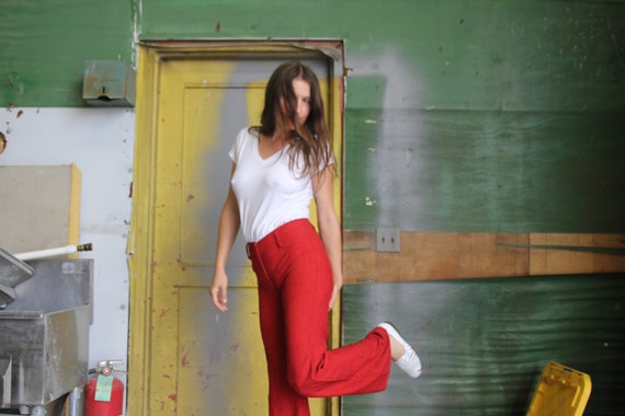 Red kick flare trousers