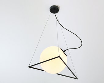 INCIRCLE Black minimal modern geometric pendant lamp from Balance Lamp with white globe glass lampshade