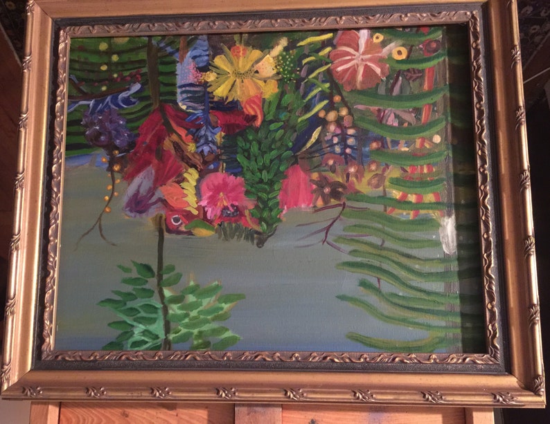May include: A framed painting depicting a lush, tropical scene with vibrant flowers in shades of red, pink, yellow, and purple. The flowers are surrounded by green foliage and a blue sky in the background.