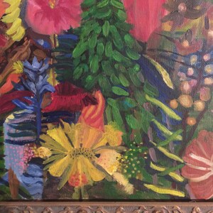 May include: A close-up of a painting depicting a vibrant floral arrangement. The flowers are painted in shades of red, yellow, blue, and green. The painting is framed in a dark brown frame.