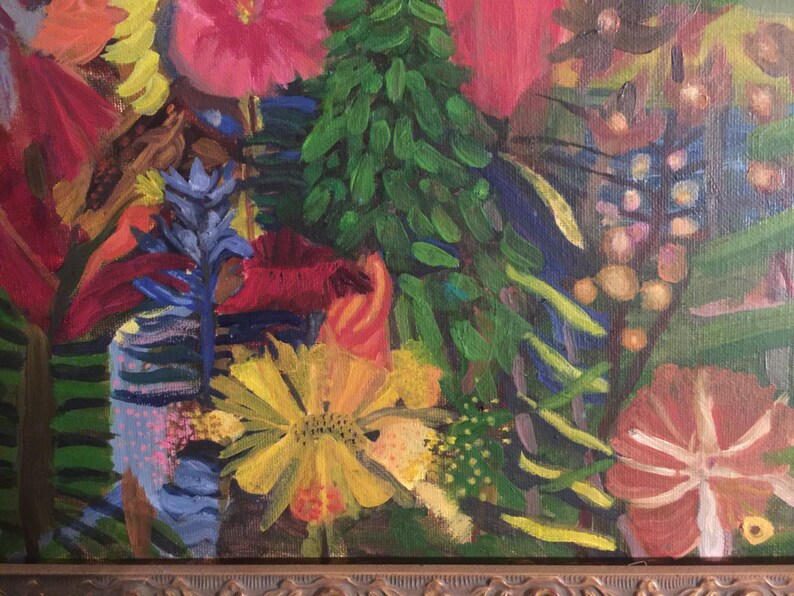 May include: A close-up of a painting depicting a vibrant floral arrangement. The flowers are painted in shades of red, yellow, blue, and green. The painting is framed in a dark brown frame.