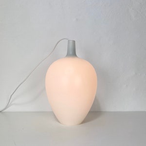 A beautiful white POMPEI glas pendant designed by Jo Hammerborg