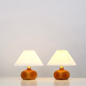 Set of small amber-coloured Le Klint table lamps | Denmark