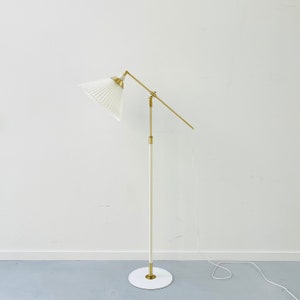 A classic white Le Klint 349 floor lamp by Aage Petersen | Denmark