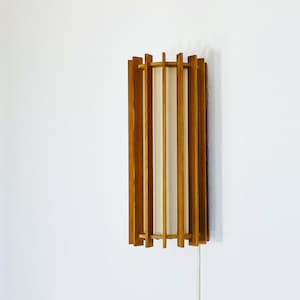 A pine wood wall lamp by Ib Fabiansen for Fog & Mørup | Denmark | 1960s