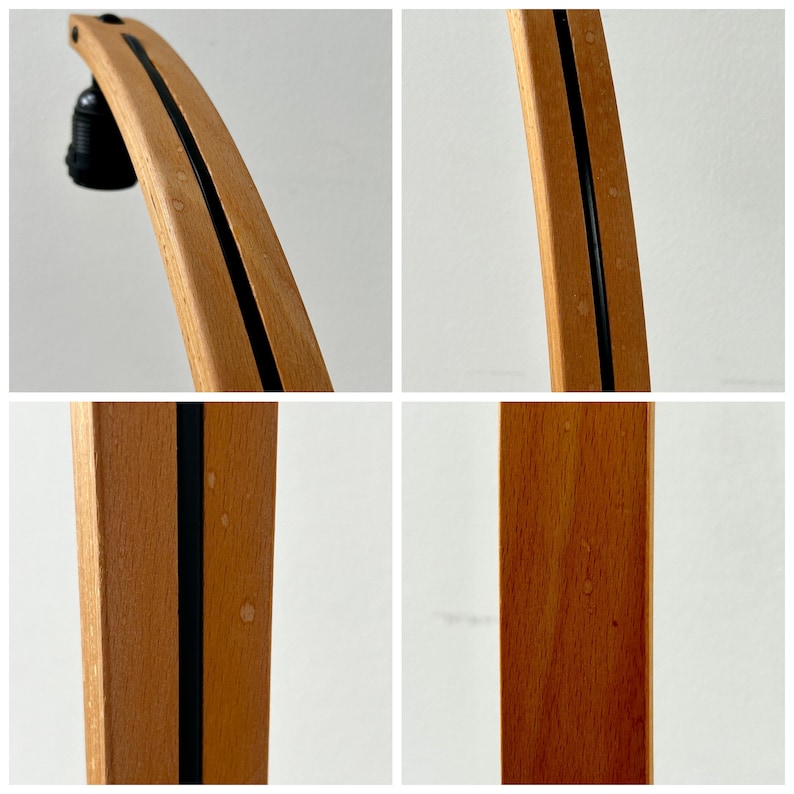 K&ouml;nnte beinhalten: Nahaufnahme eines Holzlampenfu&szlig;es mit einem schwarzen Streifen in der Mitte. Das Holz hat eine nat&uuml;rliche Oberfl&auml;che und zeigt Gebrauchsspuren.
