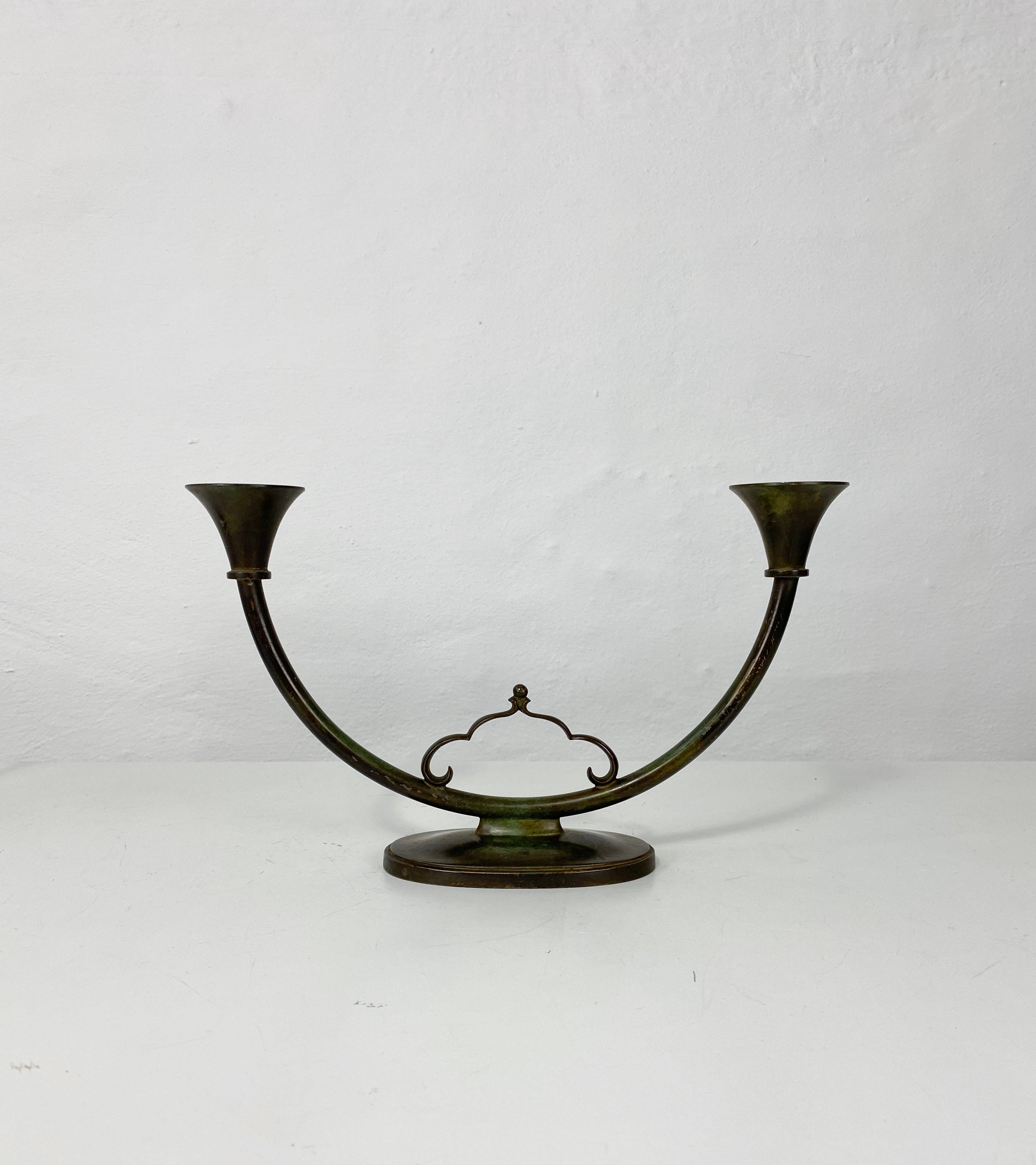 A rare pair of bronze candlestick holders designed by Just Etsy