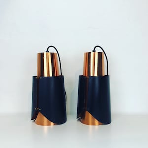 A pair of rare Bent Karlby - Østerport - pendant lights in black and copper