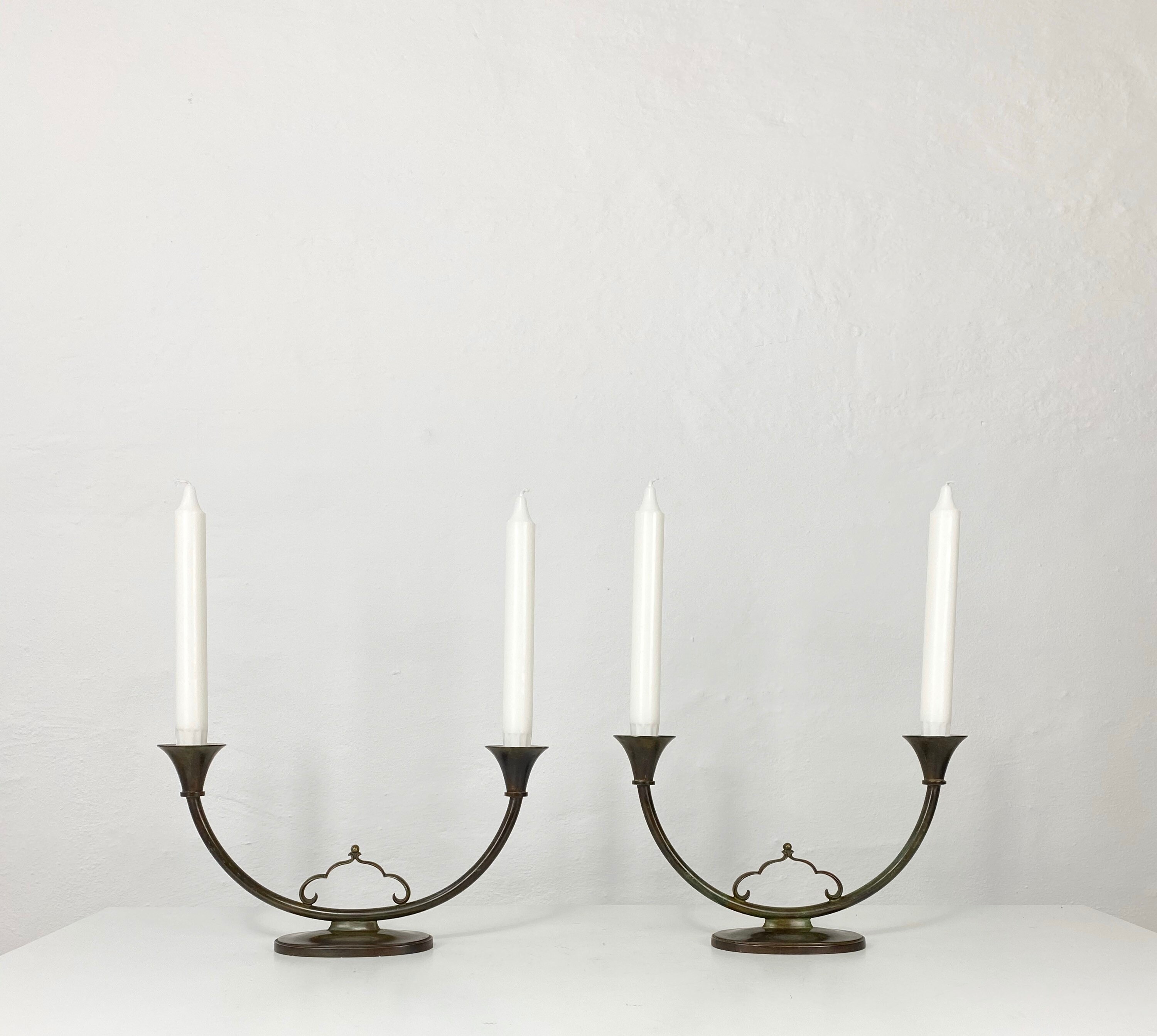 A rare pair of bronze candlestick holders designed by Just Etsy
