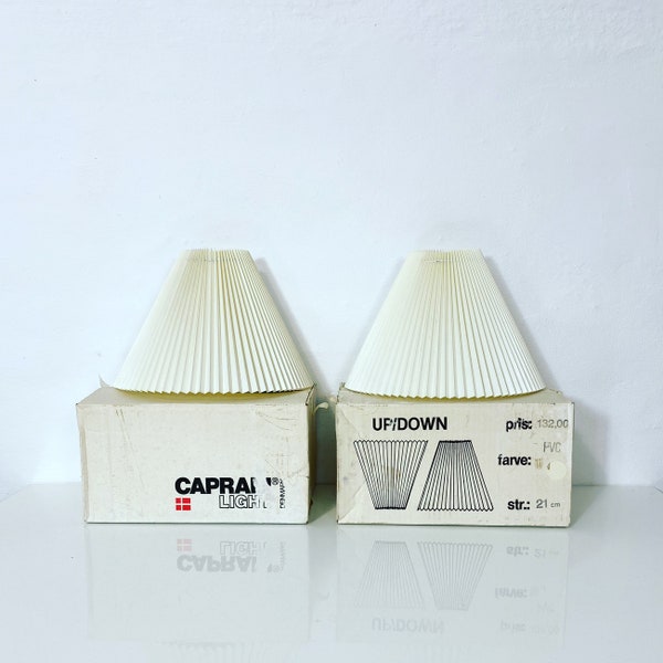 A pair of new-old-stock Caprani Light sconces