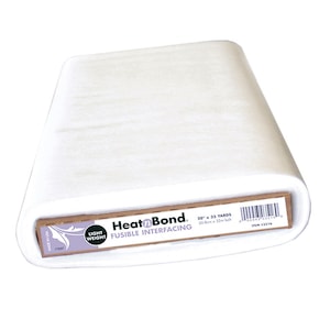May include: A white roll of HeatnBond fusible interfacing, labeled "Light Weight" and "20" x "35 Yards" (50 cm x 32 m roll).