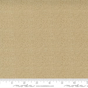 May include: A close-up of a beige fabric with a subtle textured pattern. The fabric has a slightly rough, linen-like feel. The fabric is measured in inches.