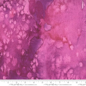 May include: Abstract watercolor fabric in shades of pink and purple with a mottled, textured appearance. The fabric has a subtle sheen and a soft, flowing feel.