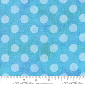 May include: Blue fabric with a white polka dot pattern. The fabric has a textured, slightly distressed look.