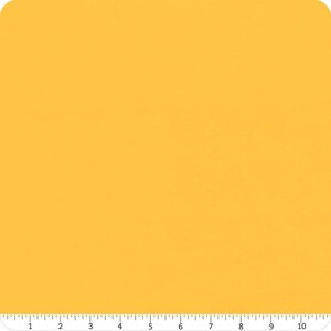Könnte beinhalten: Ein einfarbiger gelber Stoffmuster. Der Stoff ist glatt und hat einen leichten Glanz.
