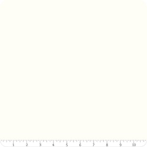 May include: Cream-colored fabric with a ruler along the bottom edge, marked in inches. The fabric is a solid, neutral color, suitable for various crafting projects. The ruler provides a visual scale for measuring the fabric.