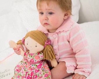Beautiful soft touch personalised rag doll with pink floral dress.