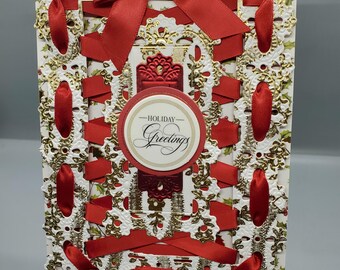 Tarjeta de felicitación navideña con lazo rojo y dorado